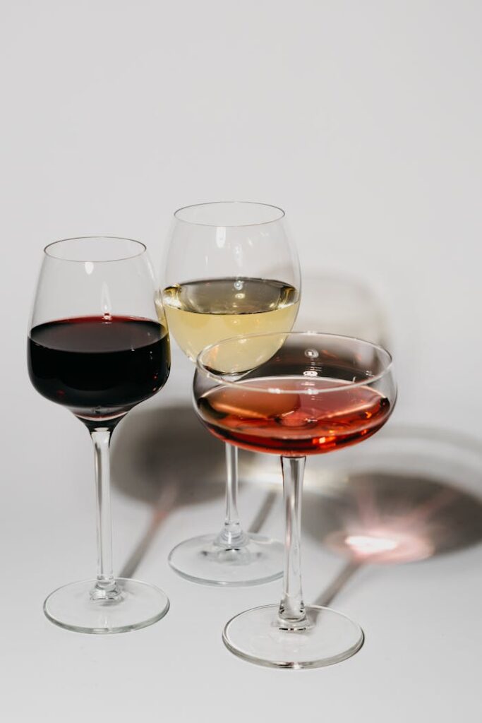 Elegant presentation of red, white, and rosé wines in stylish glassware for a sophisticated setting.
